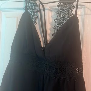 A beautiful black halter top new without tags but never been worn